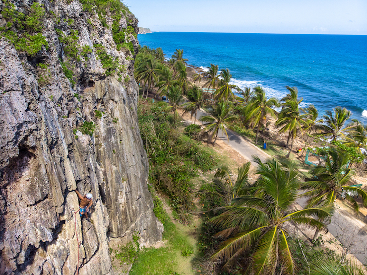 A man rock climbs.