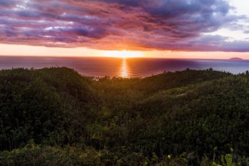 A dramatic sunset over the ocean from puntas rincon in western puerto rico