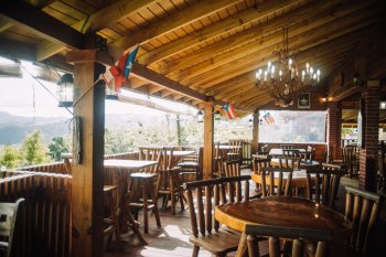 Outdoor patio overlooking the forest at Roka Dura Wine and Grill 