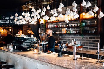 Decorative coffee cups hang from the ceiling at Bistro Cafe in Carolina.