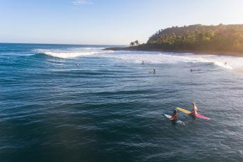 Surfers in Domes Beach
