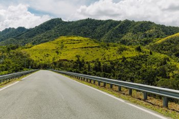 A wide view of a road through Puerto Rico's Mountains. 