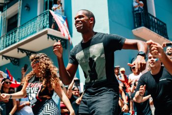 People dance in the streets of San Juan