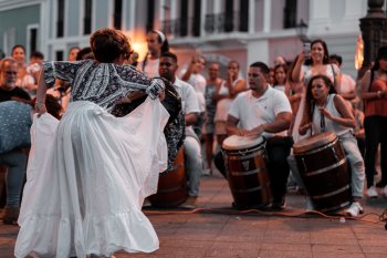 Musicians playing bomba and dancing.