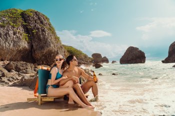 A couple relaxes at Survival Beach in Aguadilla. 