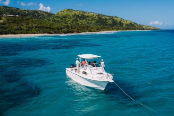 A boat anchored off a beautiful beach in Puerto Rico