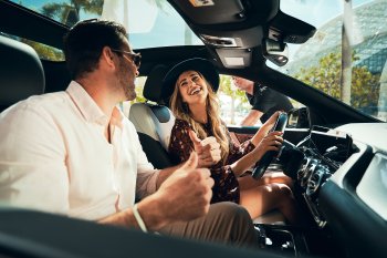 Woman and men inside a car.