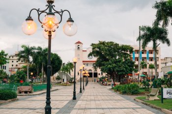 A historic plaza is lined with vintage-style lamp posts in Caguas, Puerto Rico.