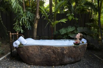 Woman in spa bath.