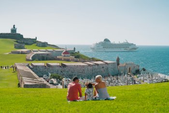 Family looking at cruise ship. 