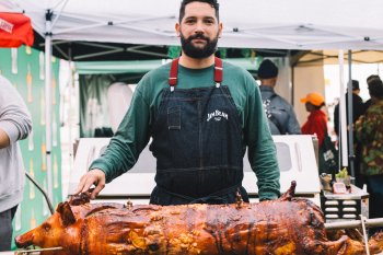 Chef Manolo López roasting a lechon.