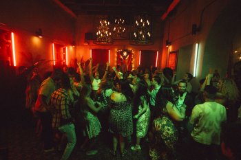 A group of people dancing at a bar in San Juan, Puerto Rico