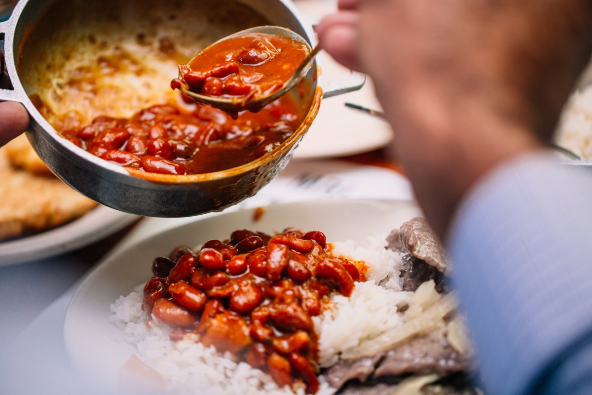 A chef plates a beautiful dish at Doña Ana Restaurant.