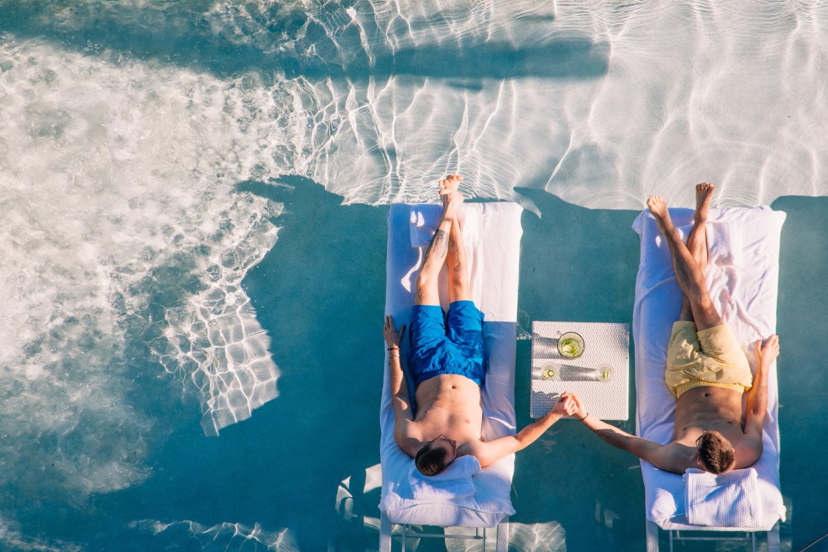 A couple enjoys the warm waters a sandy beaches of Puerto Rico