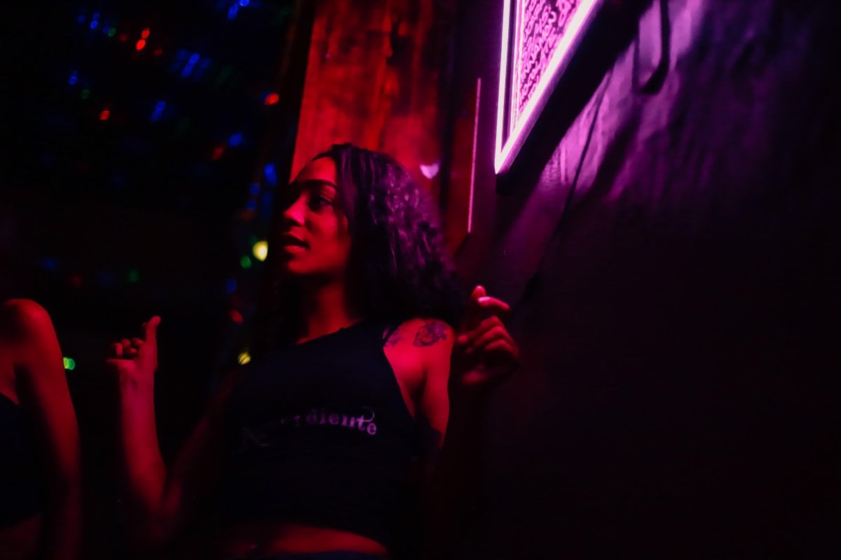 A woman dancing at Aguardiente in Santurce. 