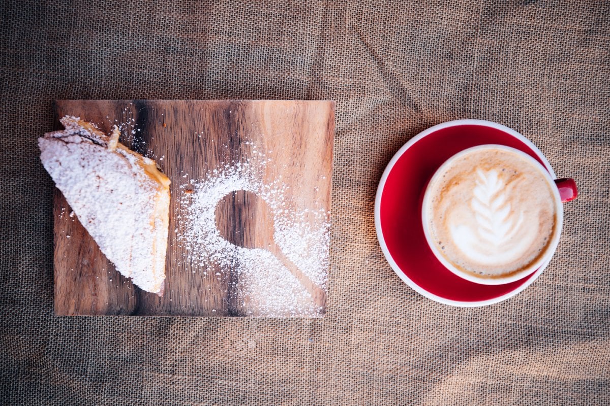 A cup of Puerto Rican coffee and a mayorca.