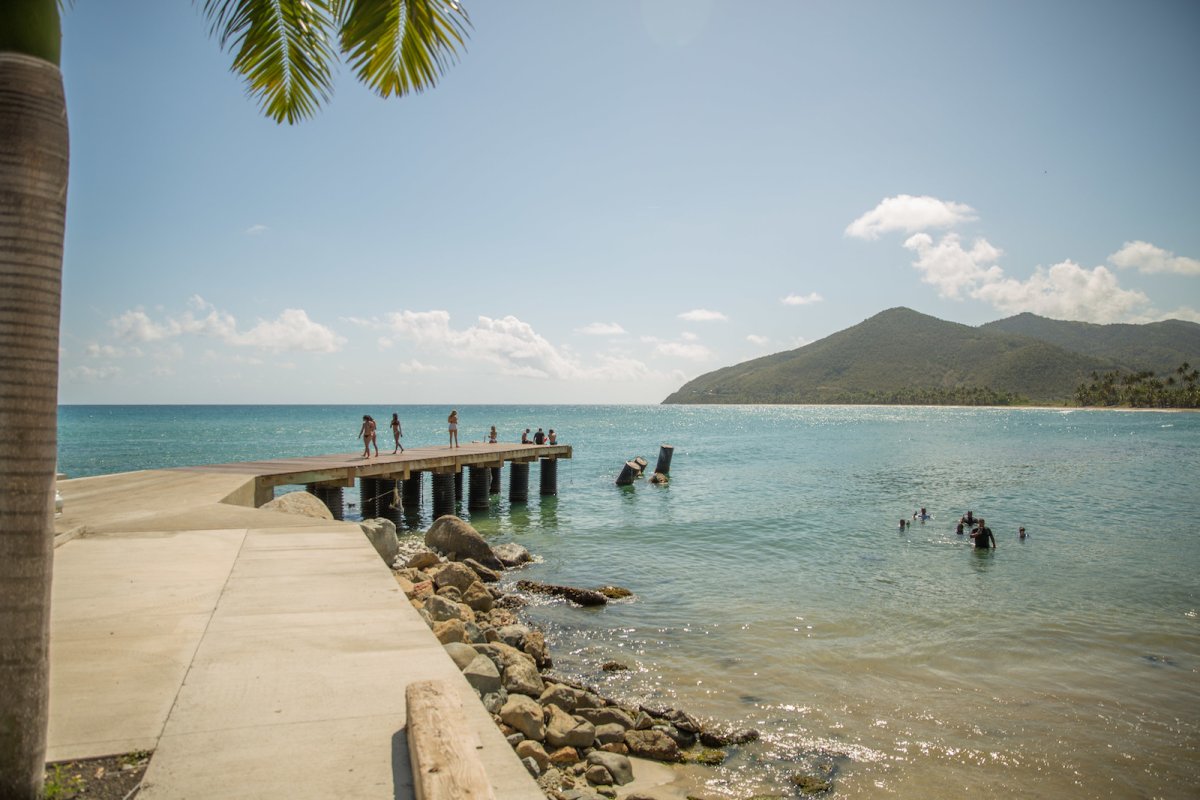 Beach goers enjoy the beautiful waters off Maunabo.