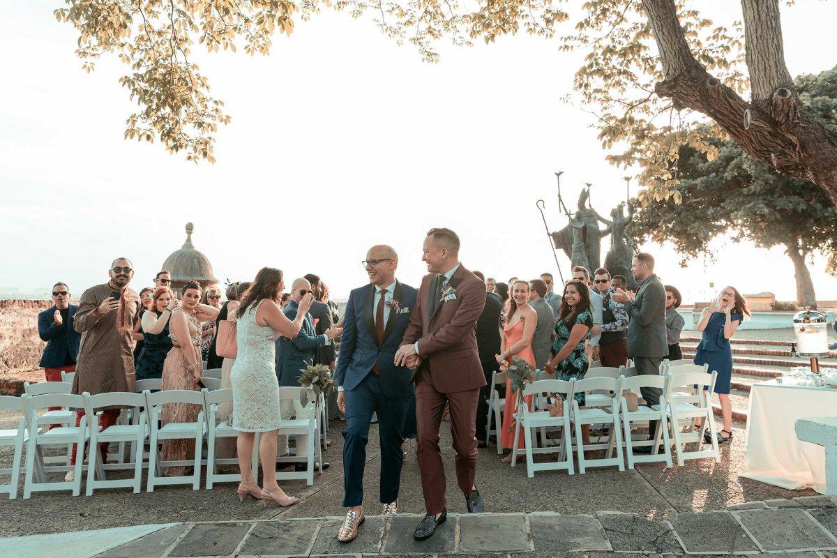 A same-sex couple walk down the aisle after getting married at Plazuela de la Rogative in Old San Juan, Puerto Rico.