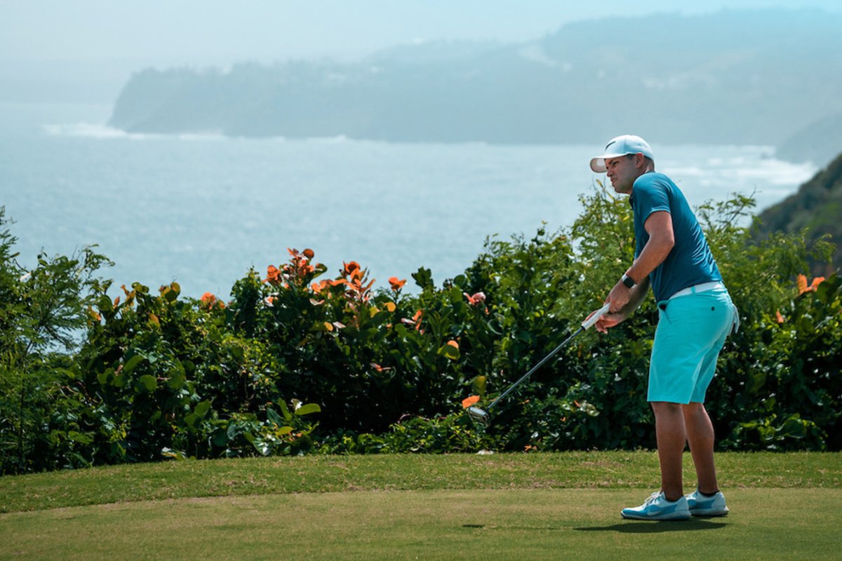 Man golfing at The Links at Royal Isabela, an oceanfront golf course in Isabela, Puerto Rico.