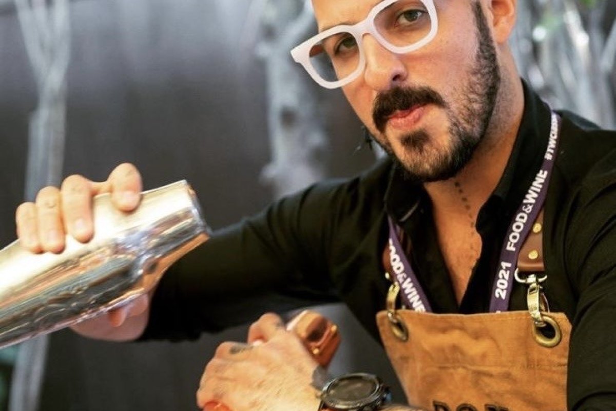 Bartender Israel Bravo mixing drinks.