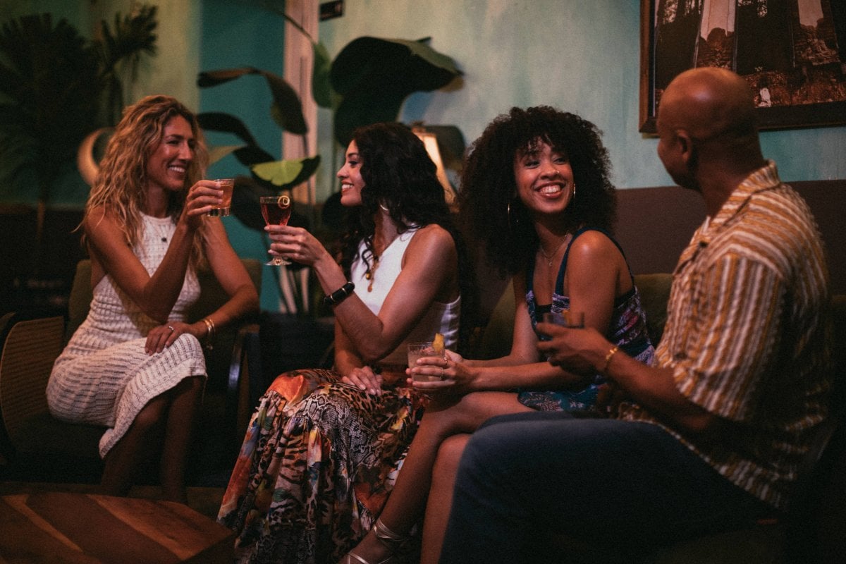 Group of people in a bar with drinks