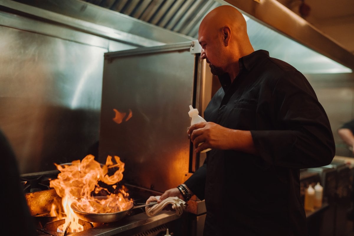 Chef Mario Pagan cooking in the kitchen.