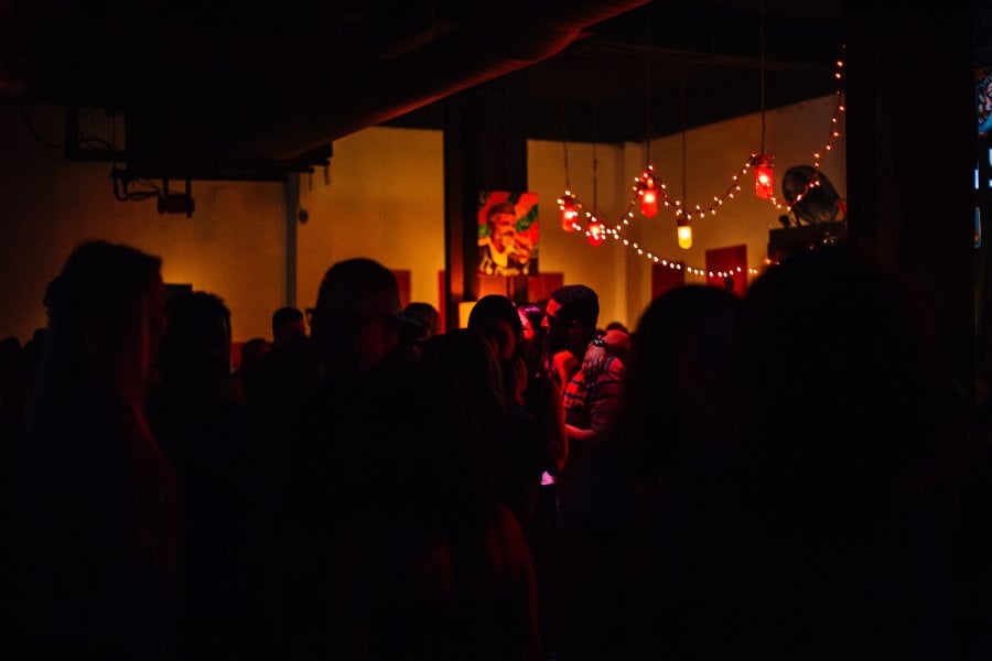 Group of people standing in La Respuesta, a well-known bar in San Juan, Puerto Rico.