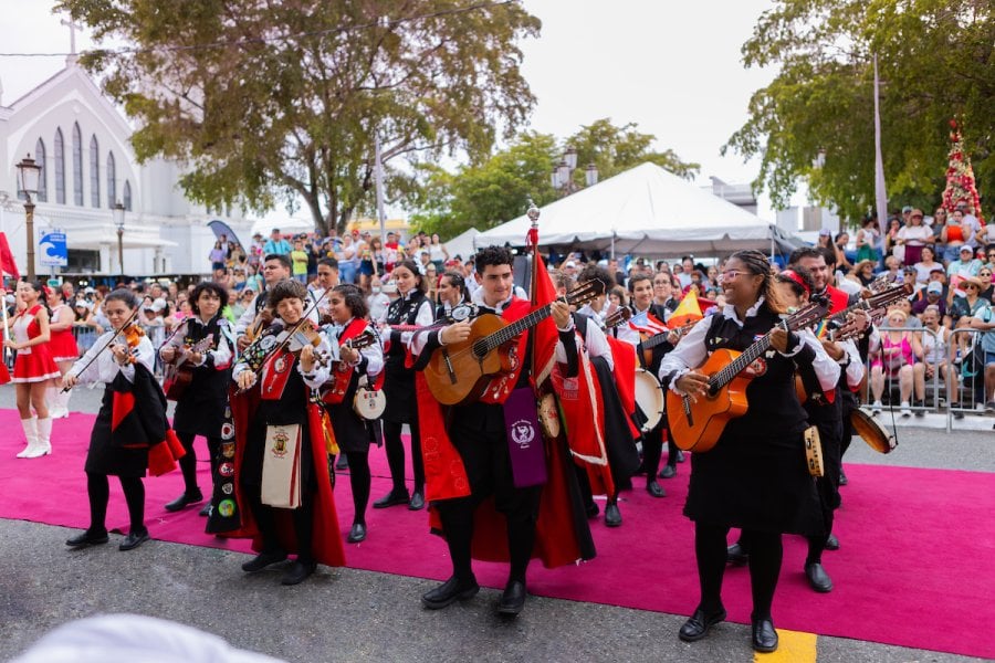 The UPR Tuna, a folkloric musical group, playing at an outdoor event.