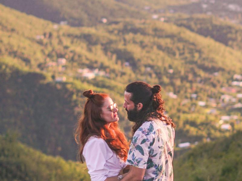 a couple gazing at each other at Piedras del Collado in Salinas. 