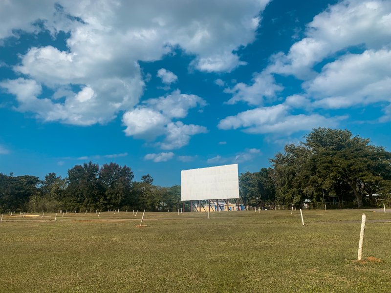 Drive in theater screen in a field.