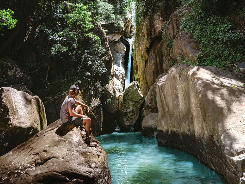 People enjoy a natural Pool in el Yunque