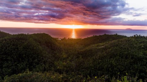 A dramatic sunset over the ocean from puntas rincon in western puerto rico