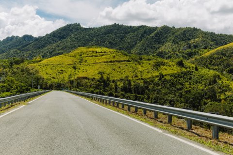 A wide view of a road through Puerto Rico's Mountains. 