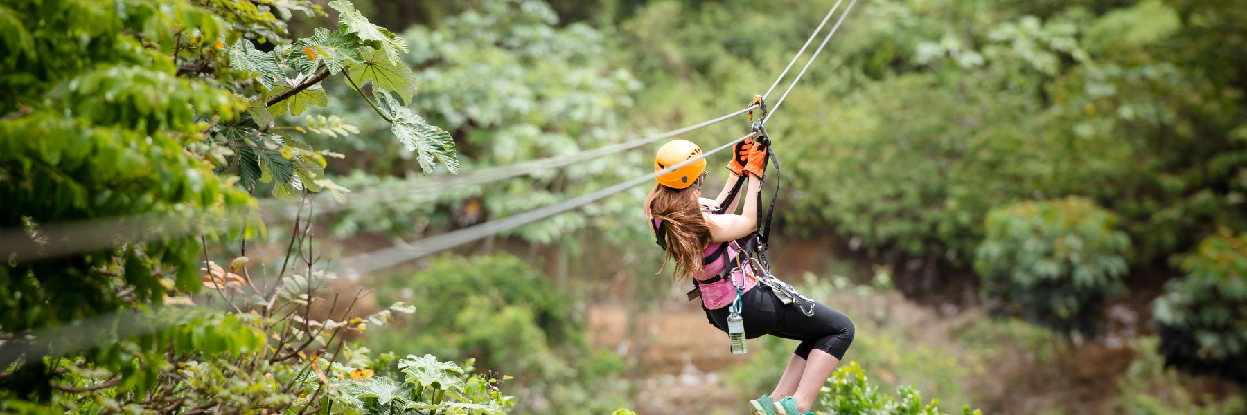 A woman glides down a zipline at Toro Verde Nature Adventure Park in Orocovis, Puerto Rico.