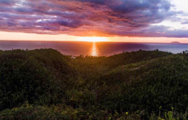 A dramatic sunset over the ocean from puntas rincon in western puerto rico