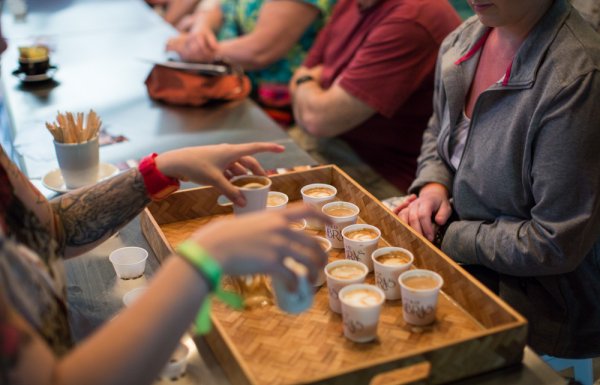 A group samples Puerto Rican coffee on a Flavors of San Juan food tour.