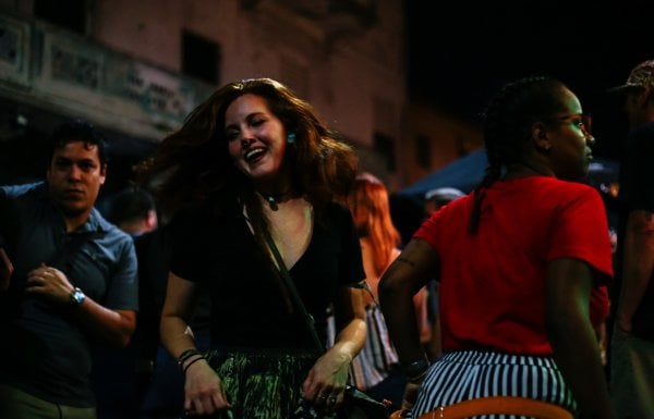 A woman dances at a nightlife spot in San Juan.