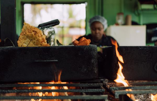 A woman serves Puerto Rican fritters