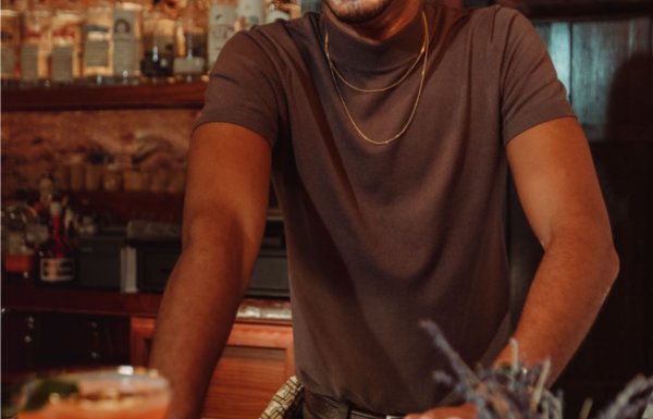 A bartender serves a drink at a bar in Puerto Rico