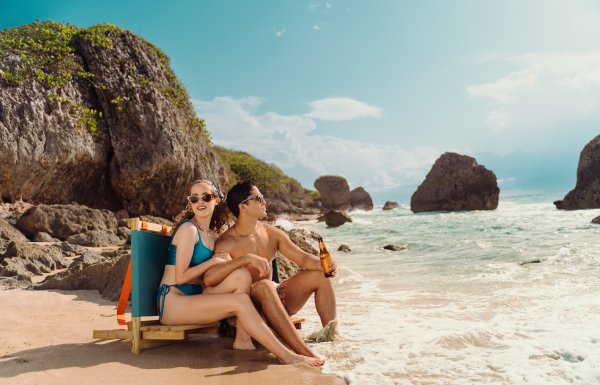 A couple relaxes at Survival Beach in Aguadilla. 