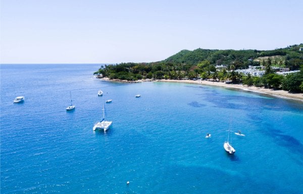 Boats anchored off a beautiful beach in Puerto Rico