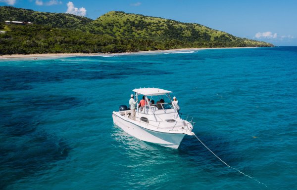 A boat anchored off a beautiful beach in Puerto Rico