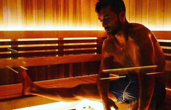 A man spreads out in a sauna at Remedy Chiropractic + Cryospa in San Juan, Puerto Rico.