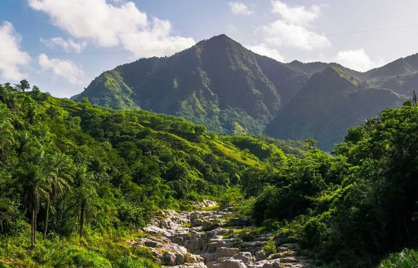 A stunning mountain landscape in Utuado, Puerto Rico, with the dramatic rock formations of Canon Blanco in the foreground.