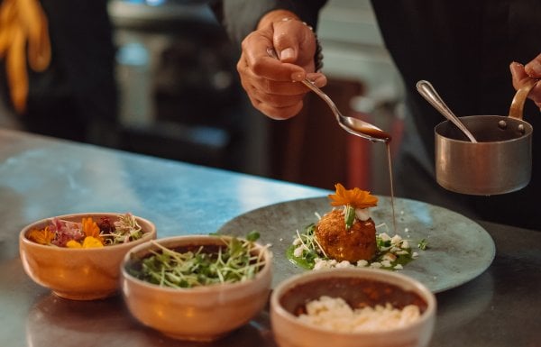 Chef plating dishes.