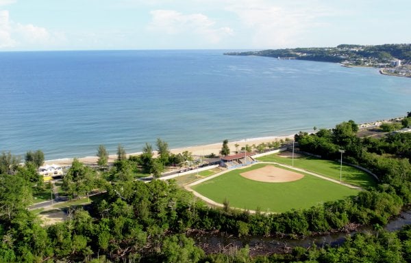 Aerial view of baseball field and beach.