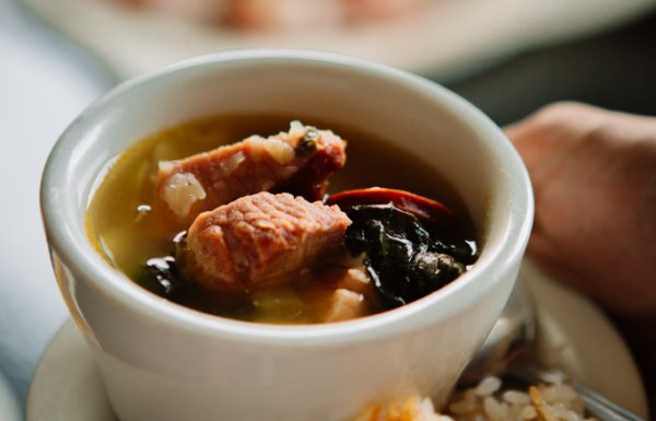 Photo of sancocho stew and rice.