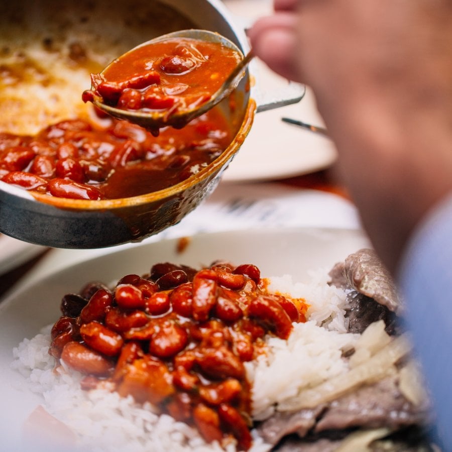 A chef plates a beautiful dish at Doña Ana Restaurant.