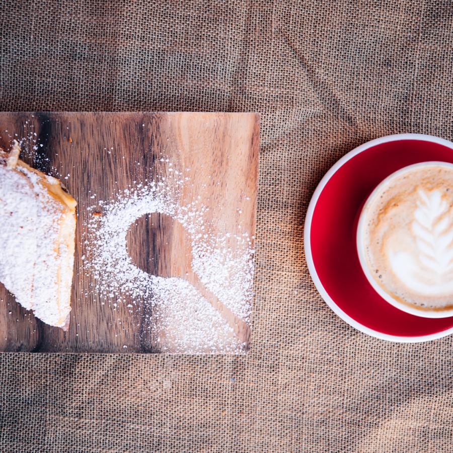 A cup of Puerto Rican coffee and a mayorca.