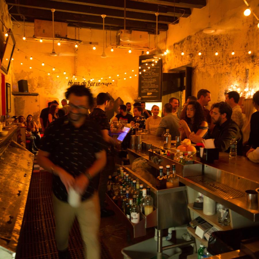 The dimly lit barroom of La Factoria in Old San Juan.